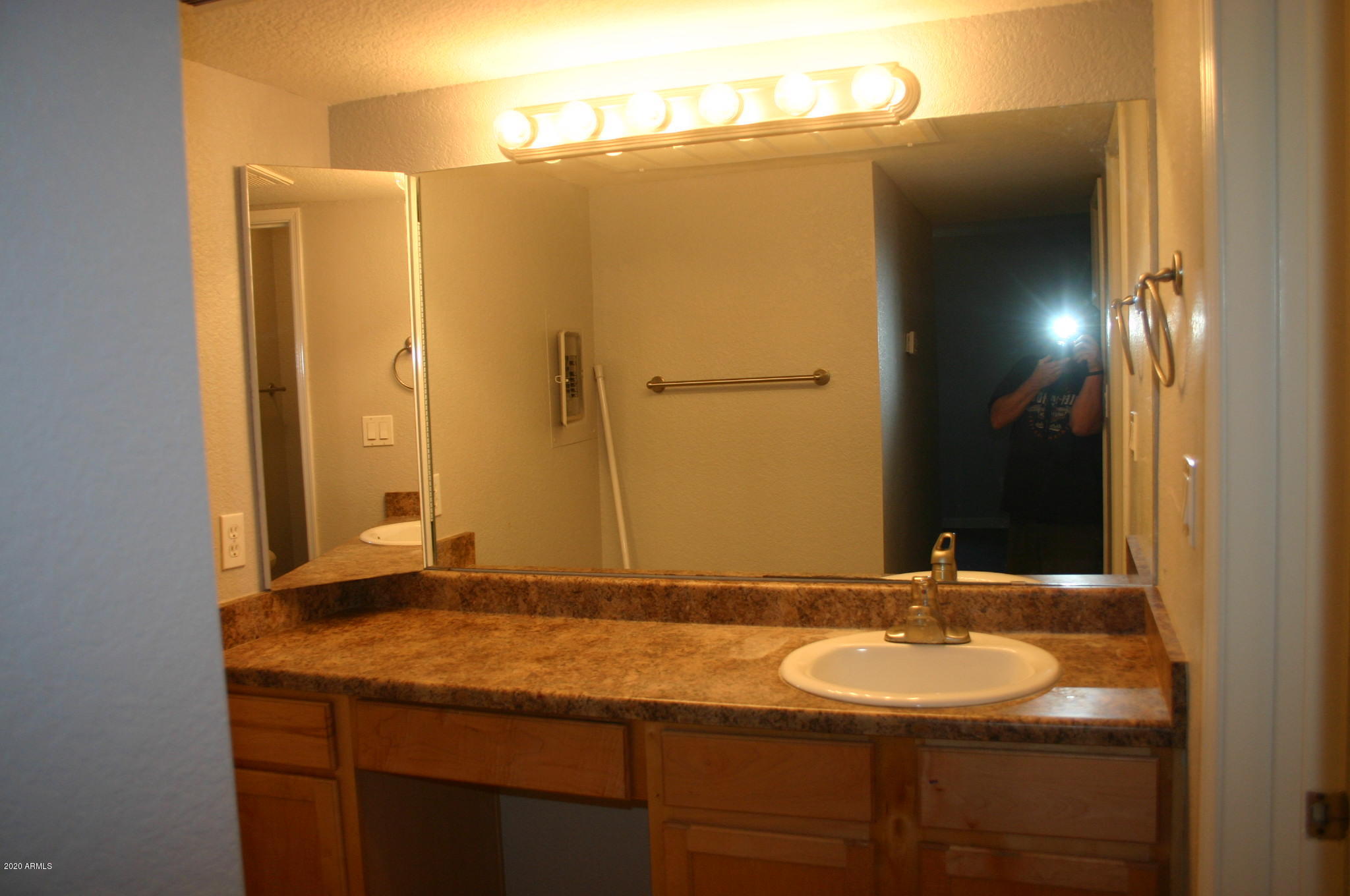 8787 East Mountain View Road, Unit 1014 Scottsdale, AZ 85258 - Photo 18 of 27 a bathroom with a sink and a mirror