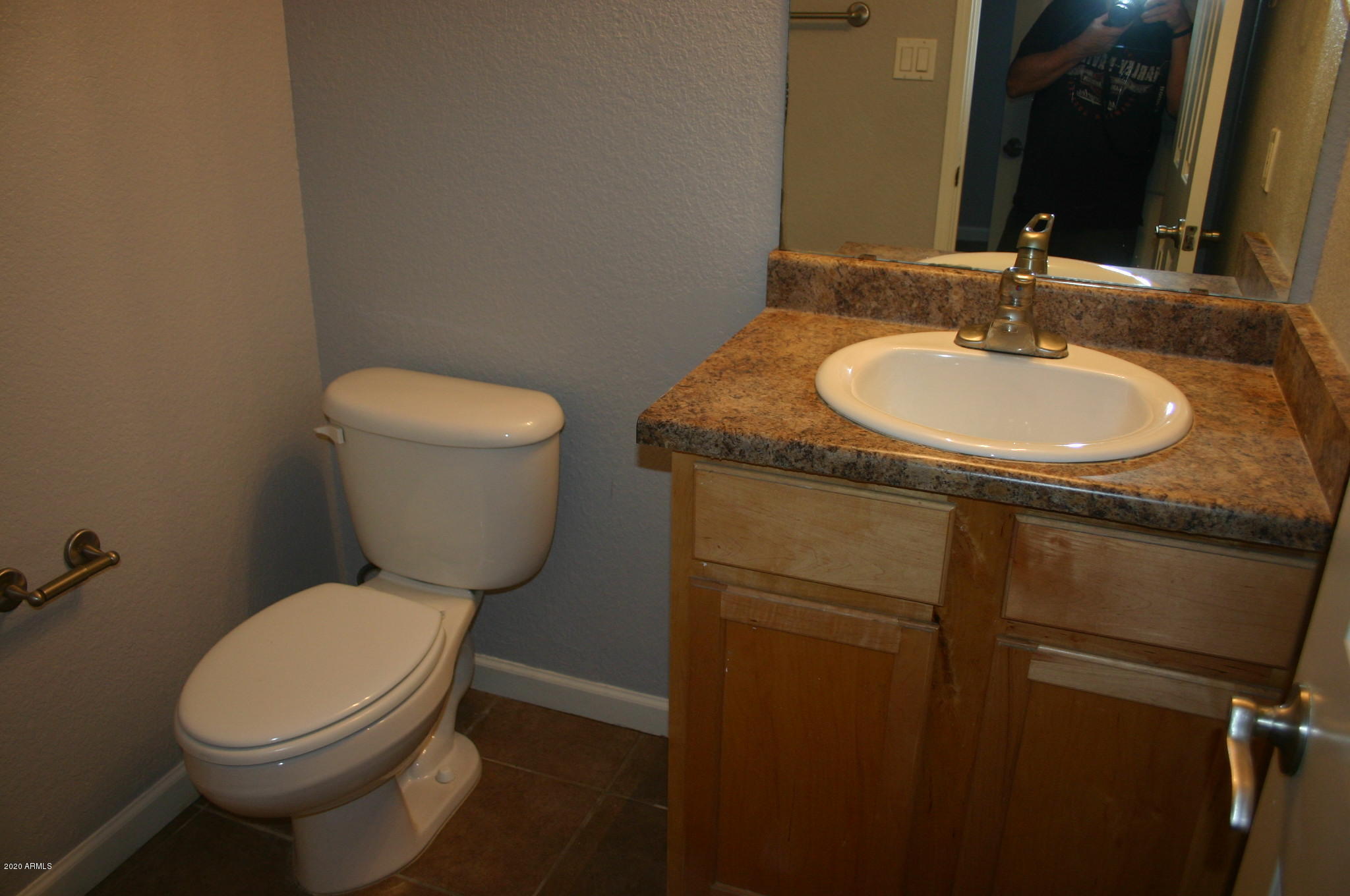 8787 East Mountain View Road, Unit 1014 Scottsdale, AZ 85258 - Photo 19 of 27 a bathroom with a granite countertop toilet and a sink