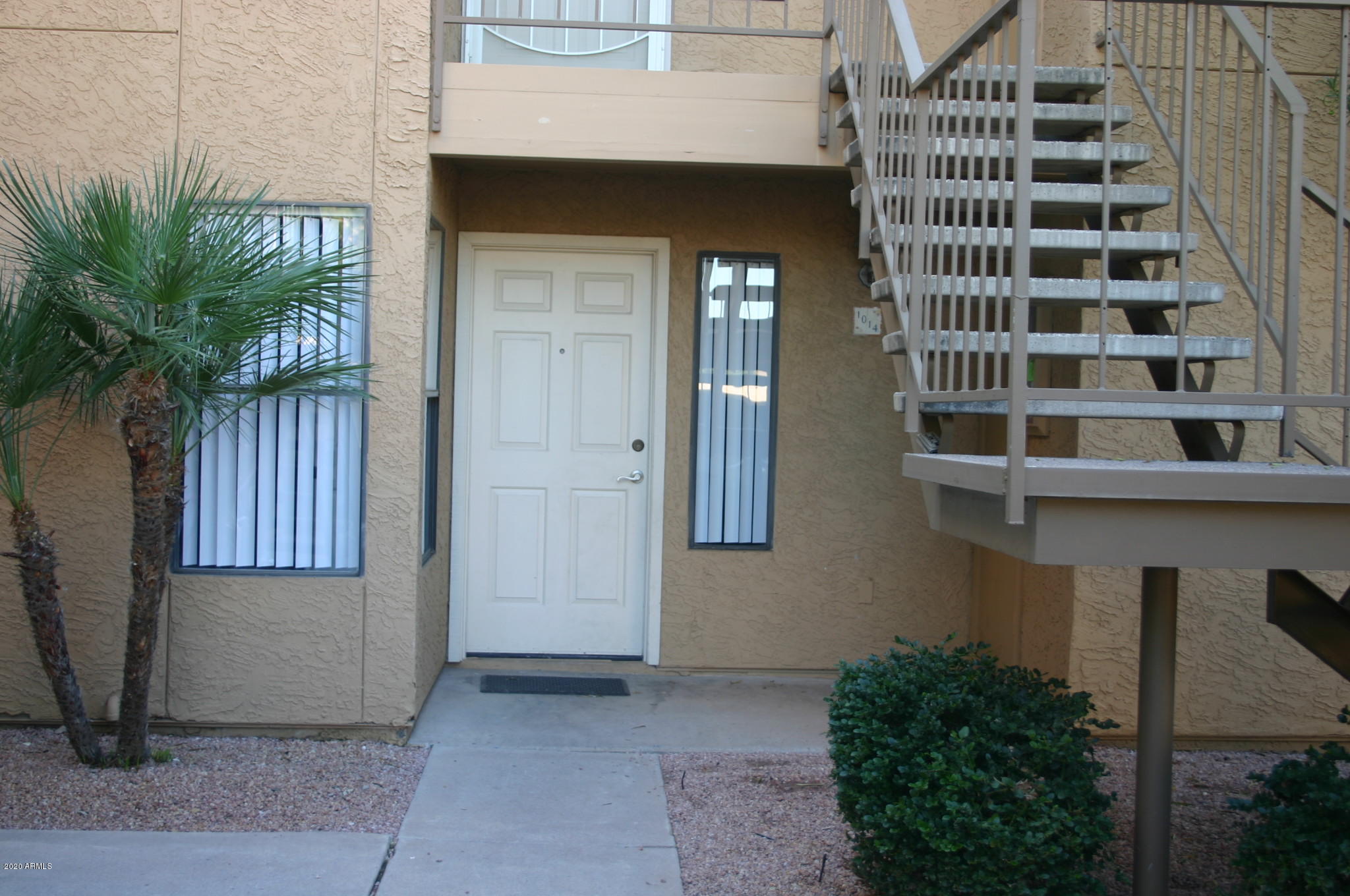 8787 East Mountain View Road, Unit 1014 Scottsdale, AZ 85258 - Photo 2 of 27 a front view of a house with a garage