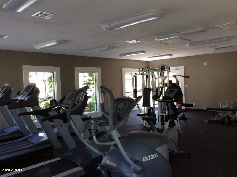 8787 East Mountain View Road, Unit 1014 Scottsdale, AZ 85258 - Photo 22 of 27 a room with lots of gym equipment