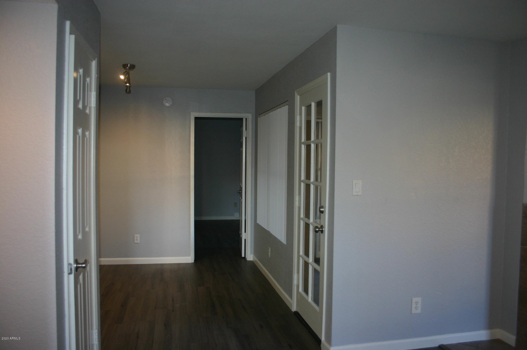 8787 East Mountain View Road, Unit 1014 Scottsdale, AZ 85258 - Photo 10 of 27 a view of a hallway with wooden floor