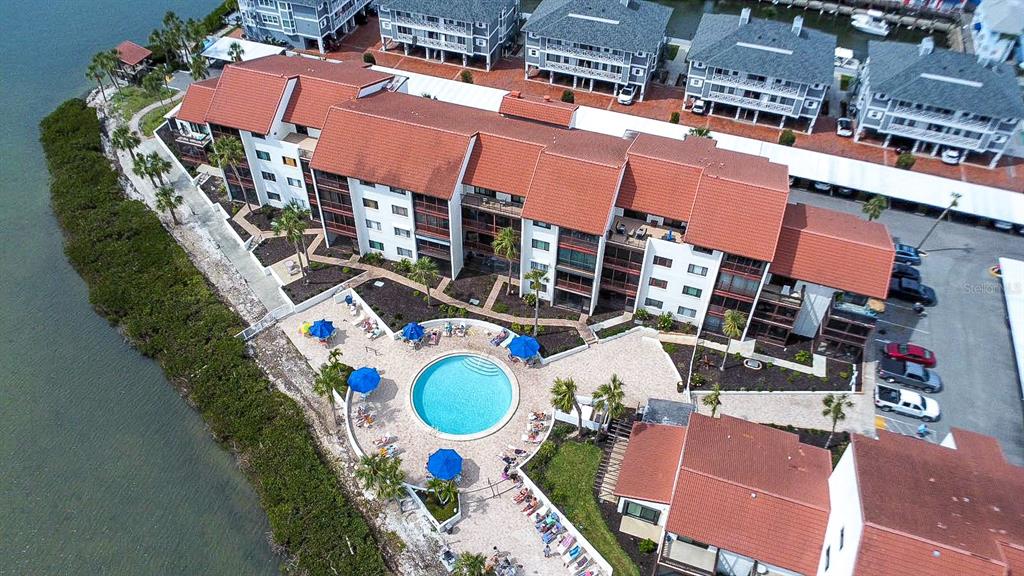 1602 Stickney Point Road, Unit 404 Sarasota, FL 34231 - Photo 38 of 38 an aerial view of a house with a swimming pool