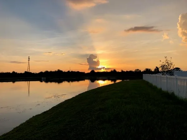 a view of a lake from a yard