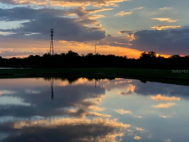 a view of swimming pool and mountain in back