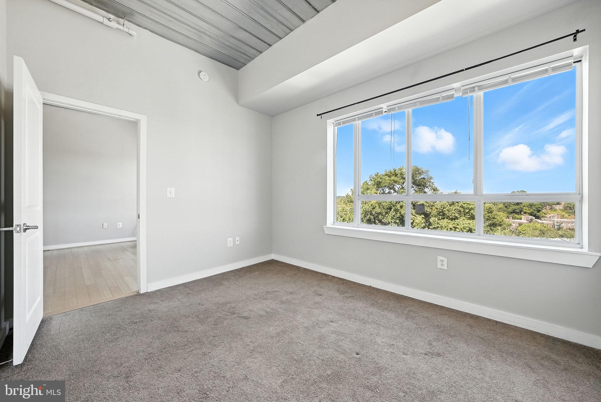 5885 Colorado Avenue Northwest, Unit 402 Washington, DC 20011 - Photo 10 of 30 a view of an empty room with a window