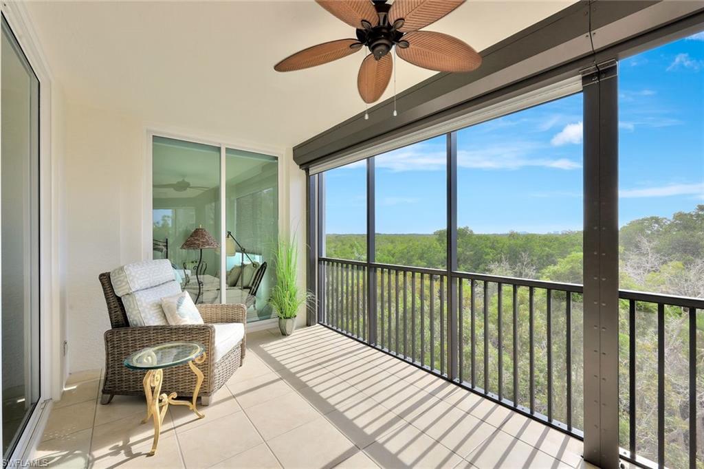 445 Cove Tower Drive, Unit 403 Naples, FL 34110 - Photo 16 of 42 a balcony view with a outdoor seating space
