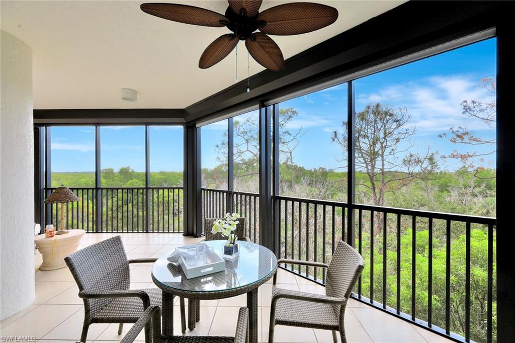 445 Cove Tower Drive, Unit 403 Naples, FL 34110 - Photo 17 of 42 a view of a city from a dining room