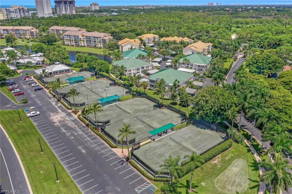 445 Cove Tower Drive, Unit 403 Naples, FL 34110 - Photo 33 of 42 an aerial view of residential houses with outdoor space
