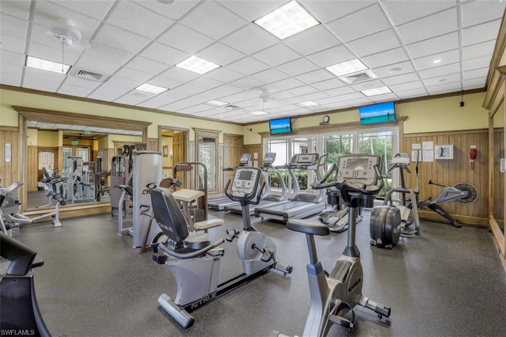 445 Cove Tower Drive, Unit 403 Naples, FL 34110 - Photo 41 of 42 a view of a room with gym equipment