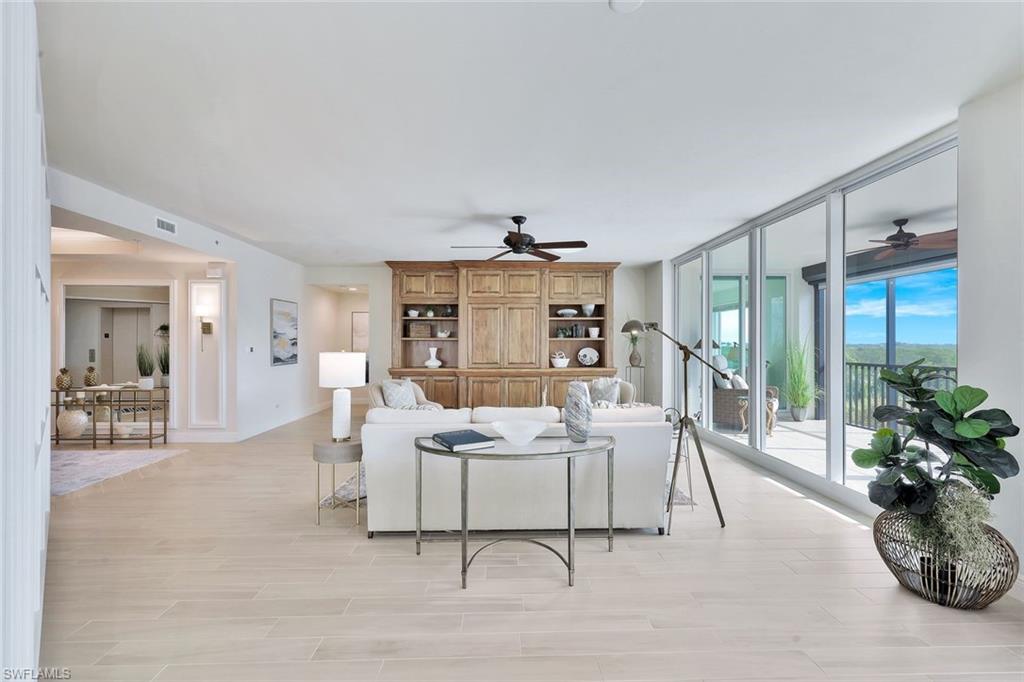 445 Cove Tower Drive, Unit 403 Naples, FL 34110 - Photo 5 of 42 a living room with furniture