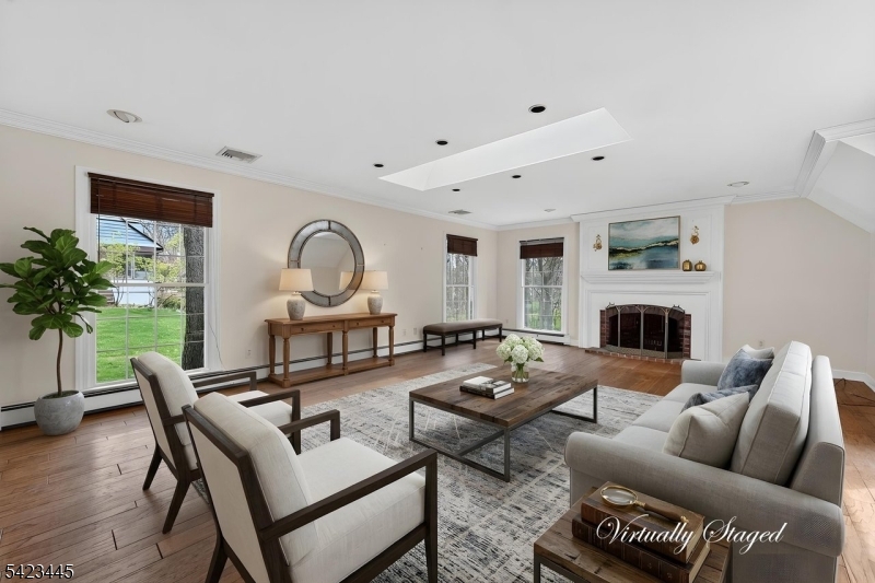 78 Orton Road West Caldwell, NJ 07006 - Photo 18 of 50 a living room with furniture a fireplace and a potted plant