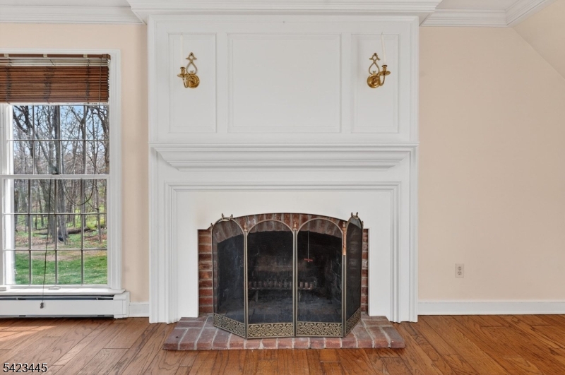 78 Orton Road West Caldwell, NJ 07006 - Photo 20 of 50 a view of a livingroom with wooden floor and a fireplace