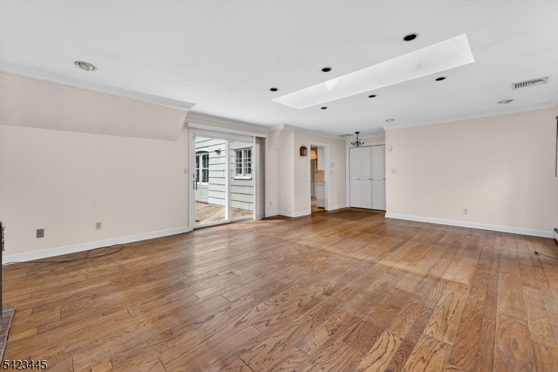 78 Orton Road West Caldwell, NJ 07006 - Photo 21 of 50 a view of an empty room with wooden floor