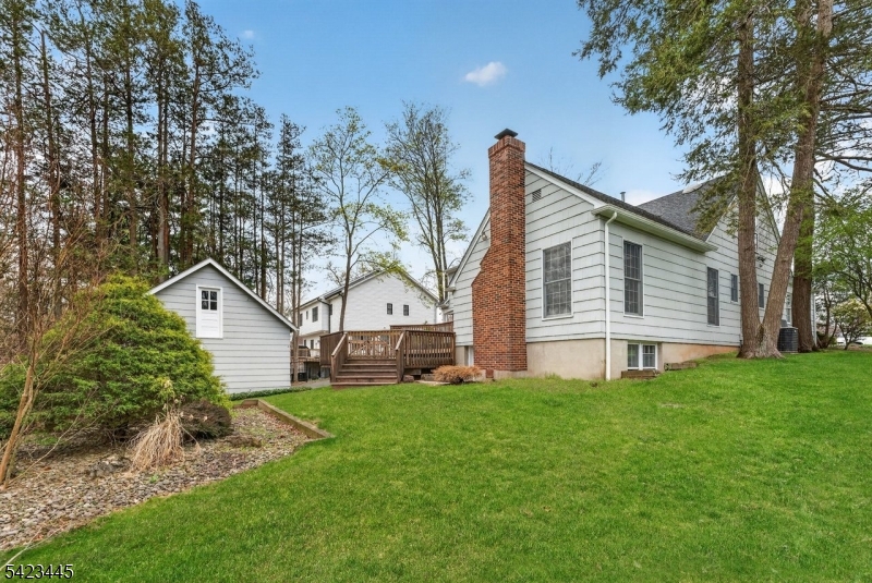 78 Orton Road West Caldwell, NJ 07006 - Photo 32 of 50 a front view of house with a garden