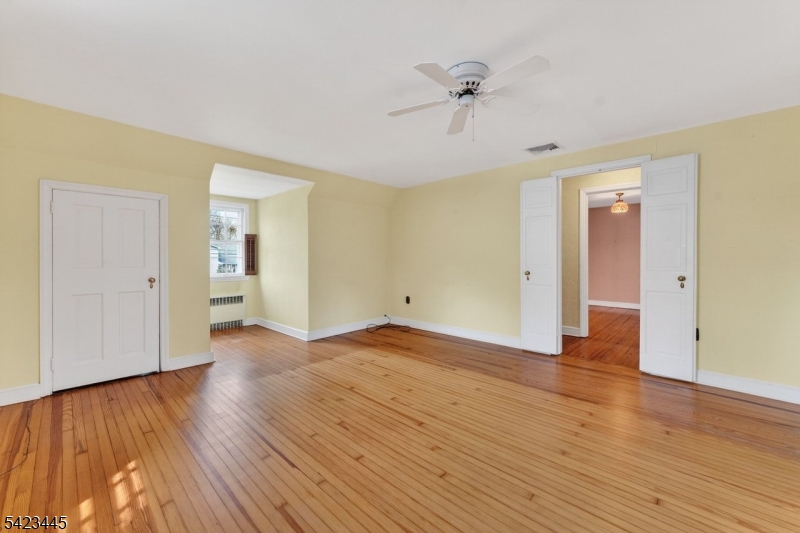 78 Orton Road West Caldwell, NJ 07006 - Photo 40 of 50 a view of an empty room with wooden floor