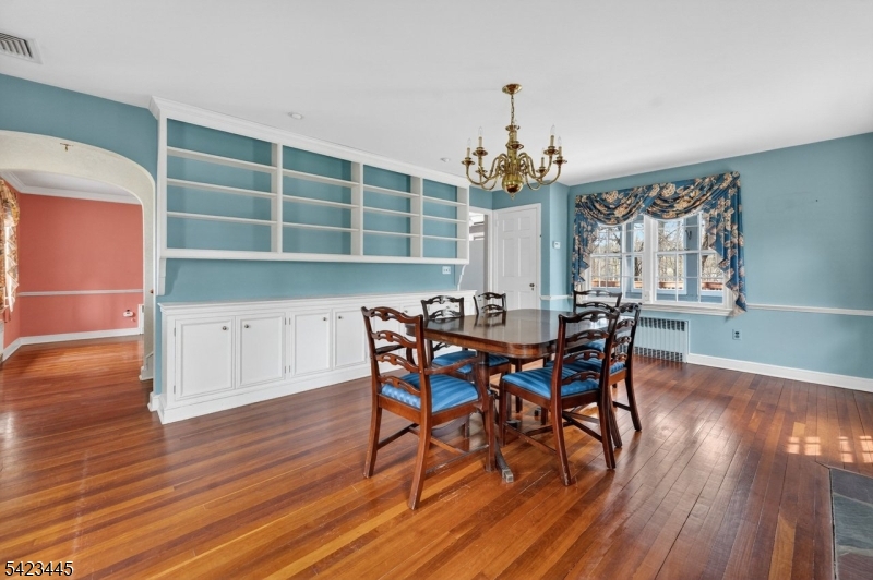 78 Orton Road West Caldwell, NJ 07006 - Photo 8 of 50 a view of a dining room with furniture and wooden floor