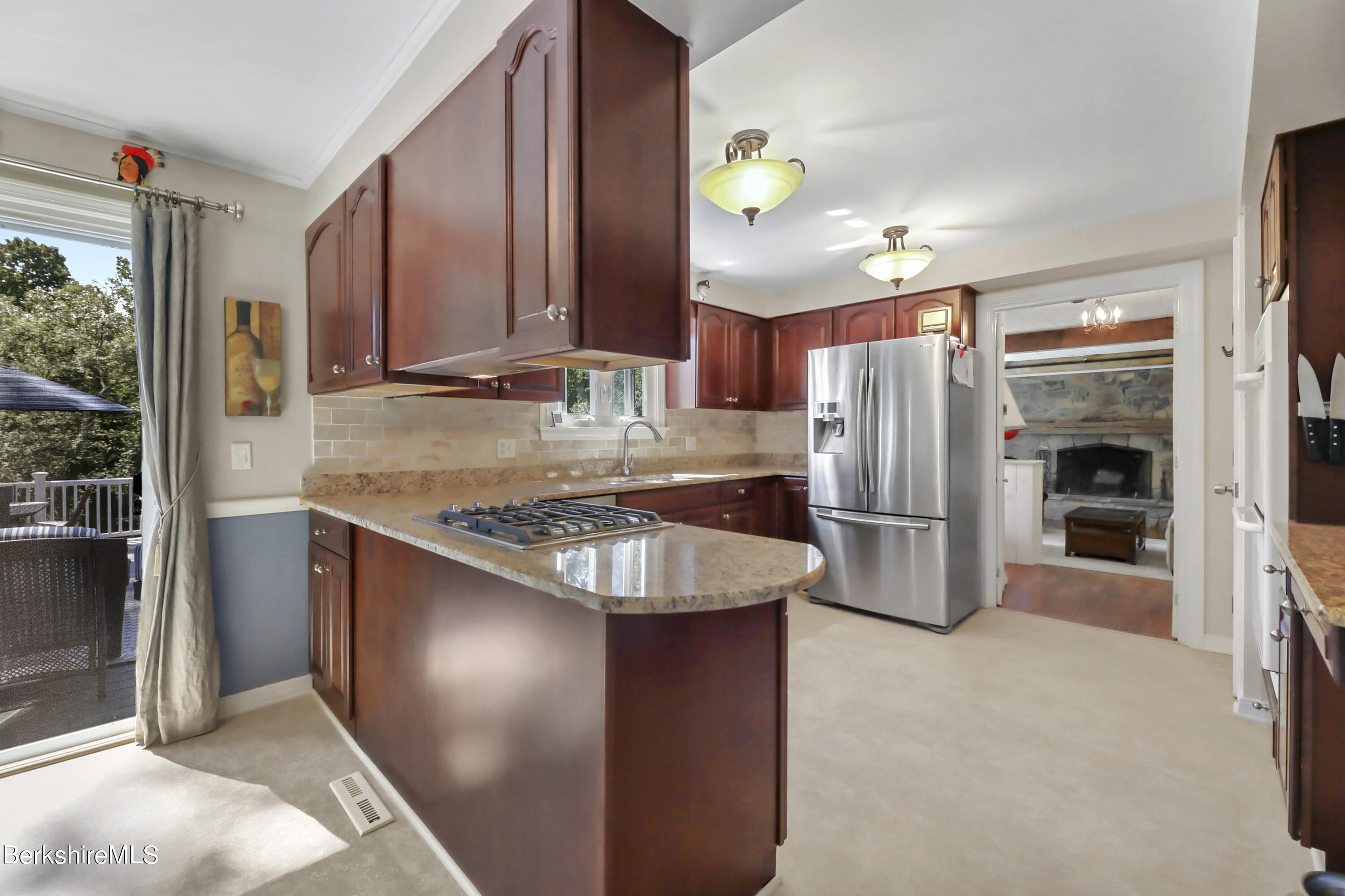 84 Brookside Drive Pittsfield, MA 01201 - Photo 11 of 54 a kitchen with refrigerator and cabinets