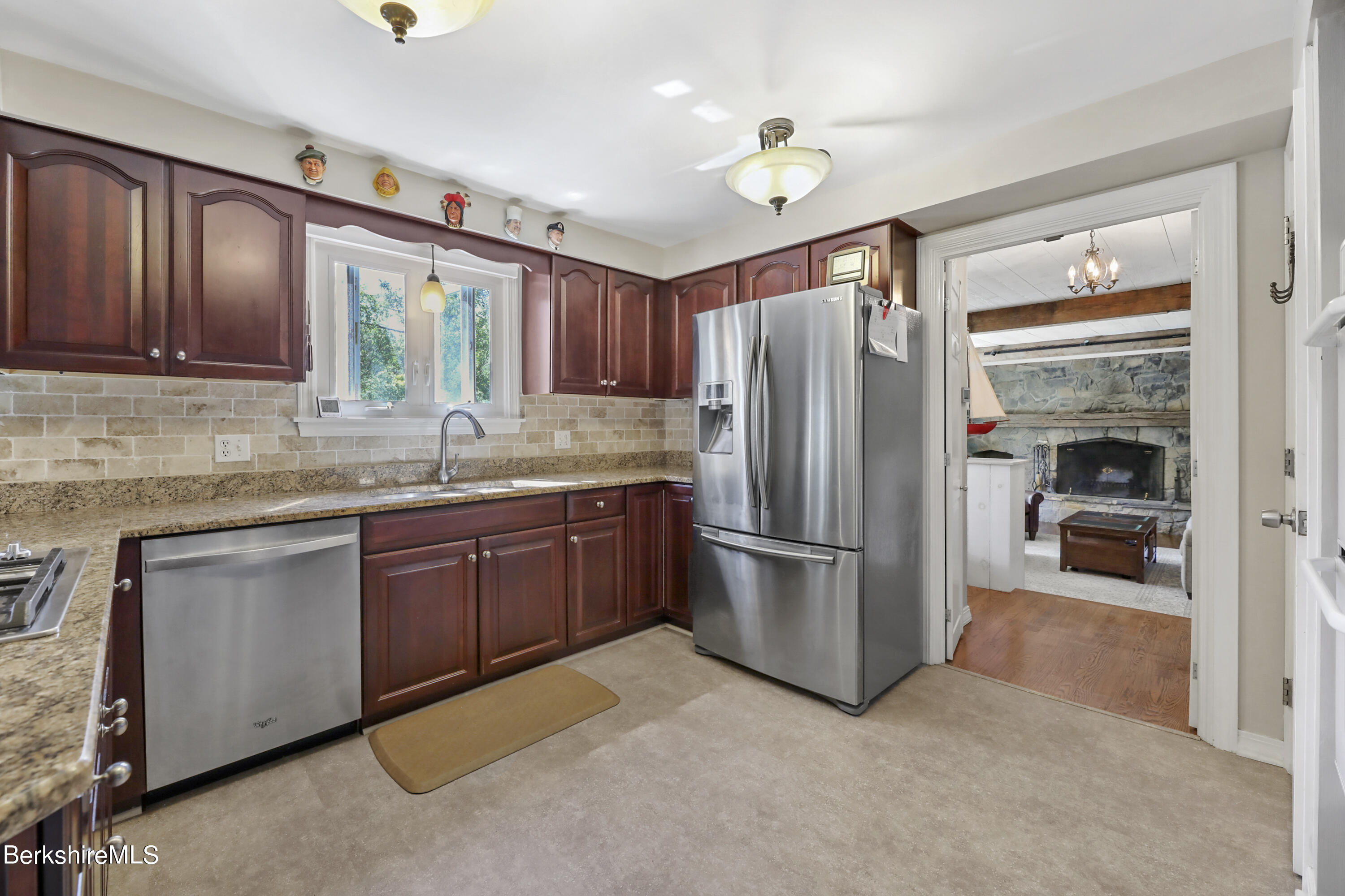 84 Brookside Drive Pittsfield, MA 01201 - Photo 12 of 54 a kitchen with stainless steel appliances granite countertop a refrigerator and a sink