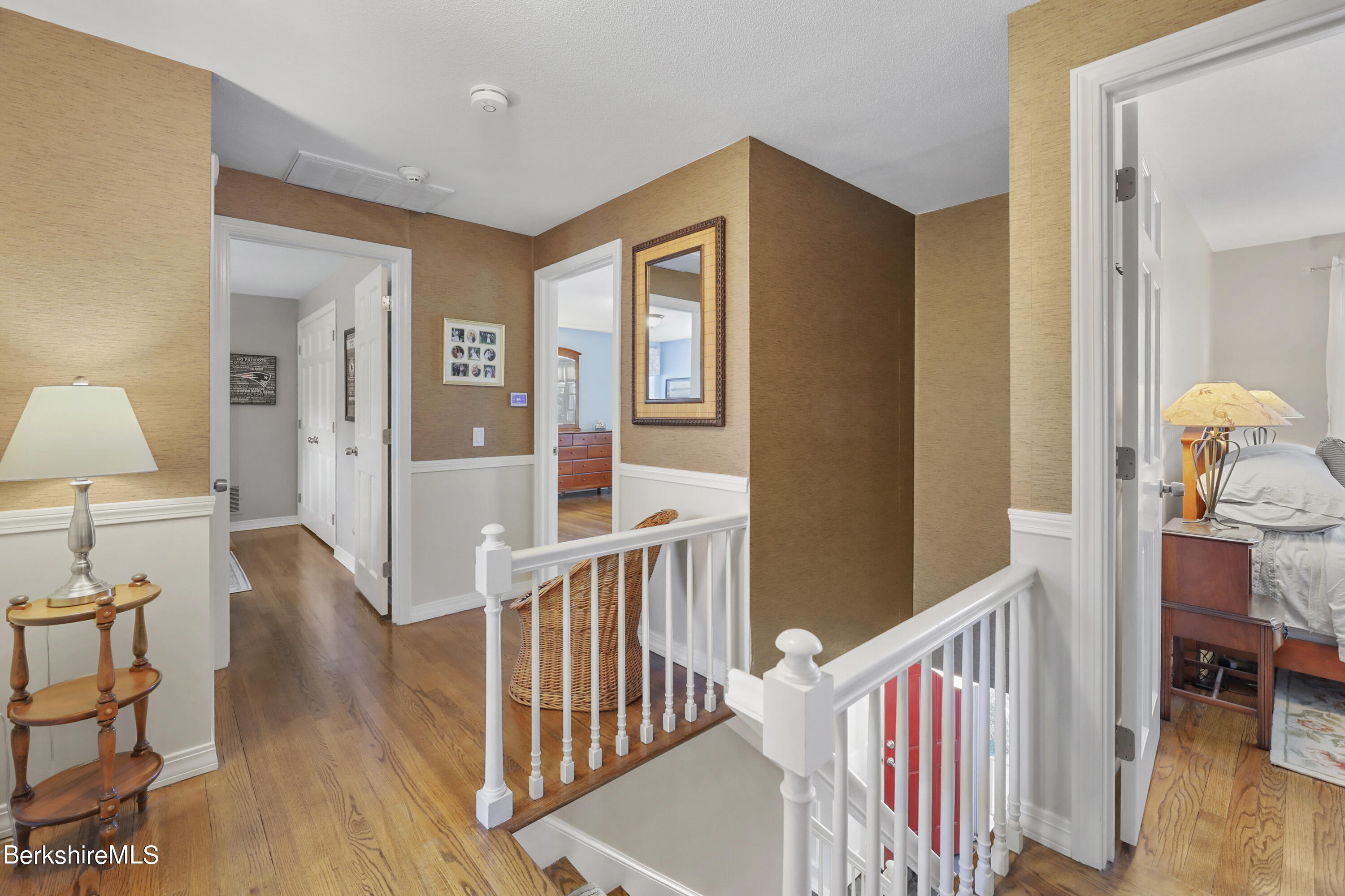 84 Brookside Drive Pittsfield, MA 01201 - Photo 23 of 54 a view of a hallway with wooden floor windows and a livingroom