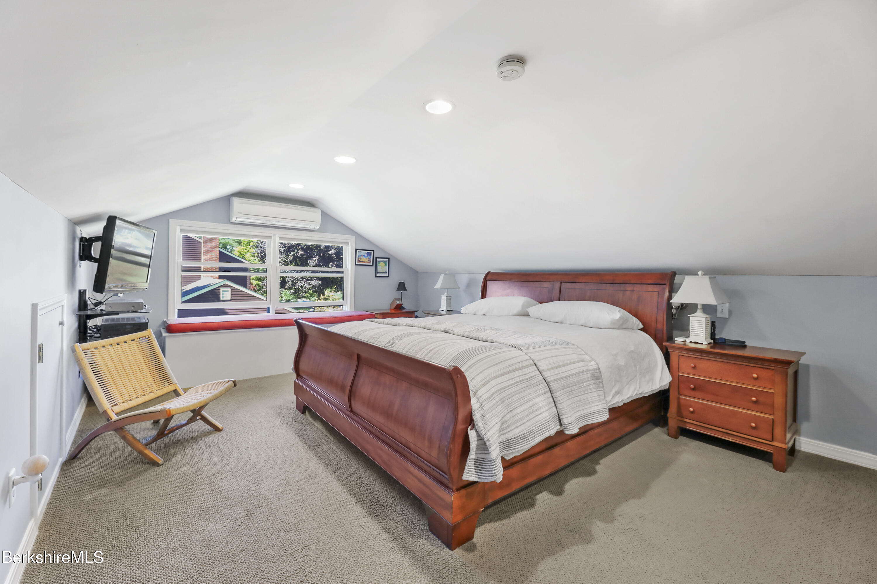 84 Brookside Drive Pittsfield, MA 01201 - Photo 26 of 54 a bedroom with a bed and a chair