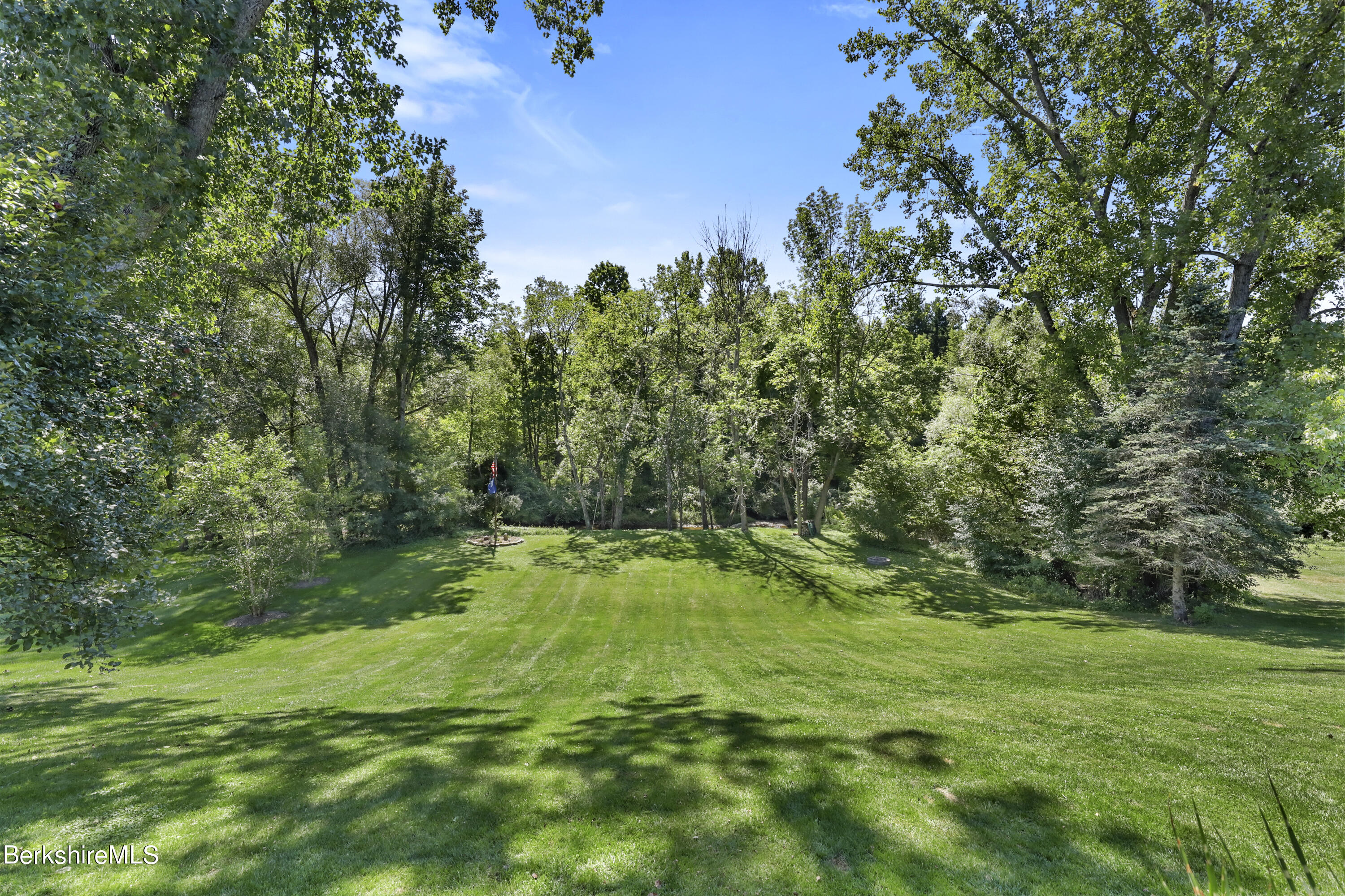 84 Brookside Drive Pittsfield, MA 01201 - Photo 44 of 54 a backyard of a house with lots of green space