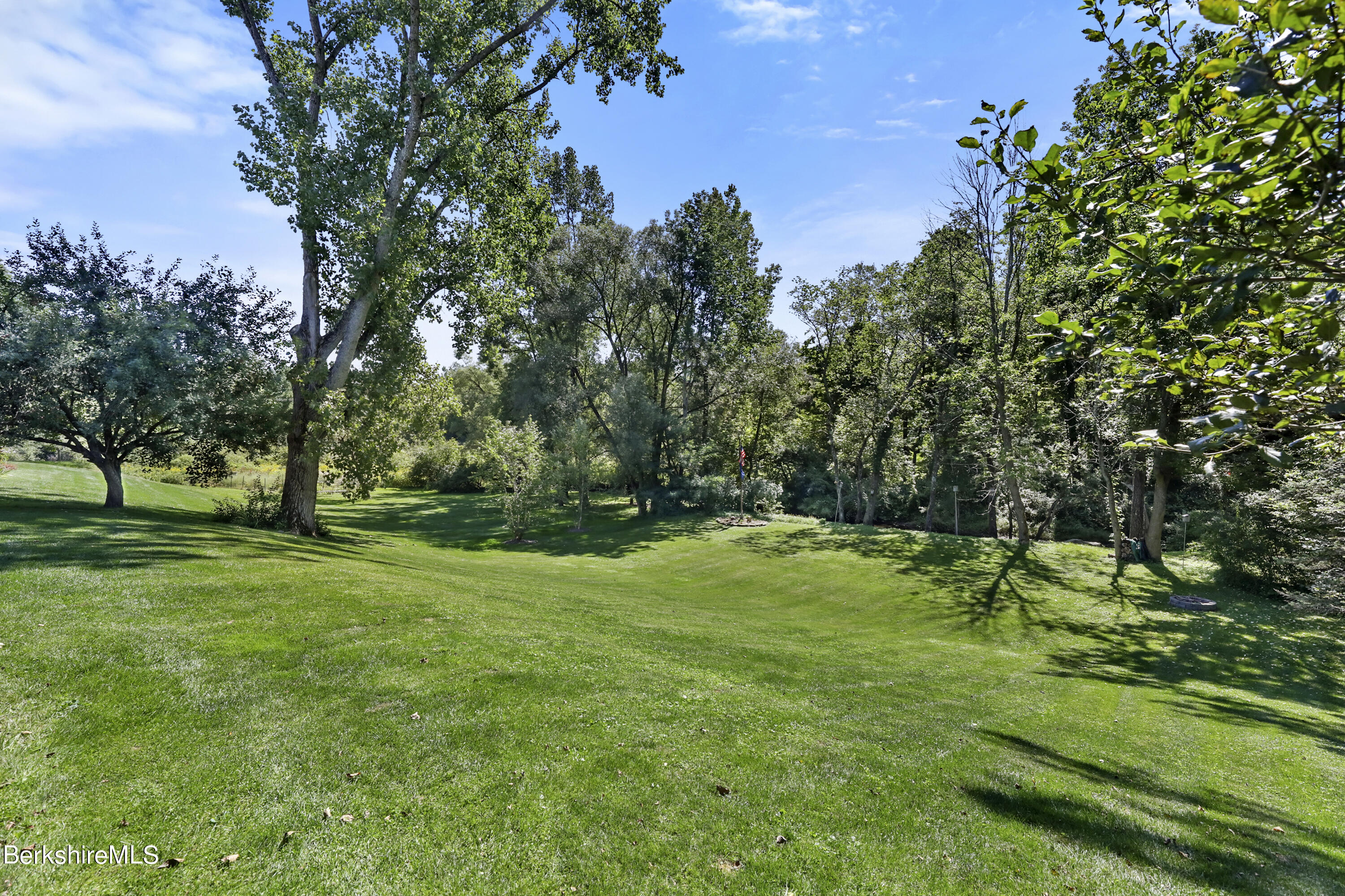 84 Brookside Drive Pittsfield, MA 01201 - Photo 45 of 54 a backyard of a house with lots of green space