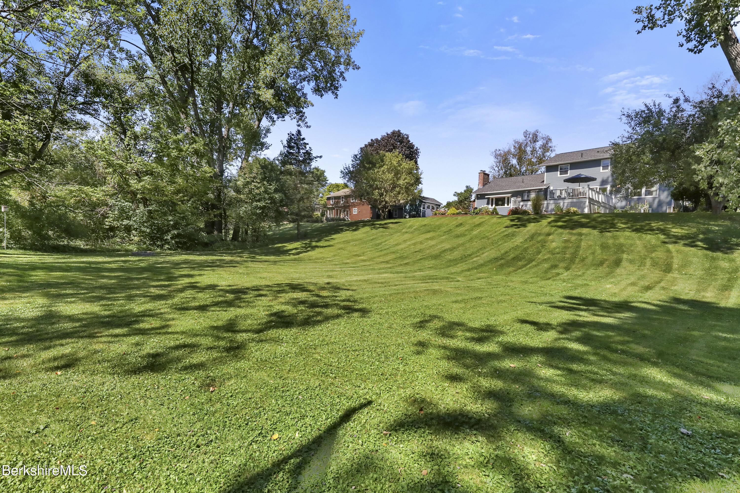 84 Brookside Drive Pittsfield, MA 01201 - Photo 46 of 54 a backyard of a house with lots of green space