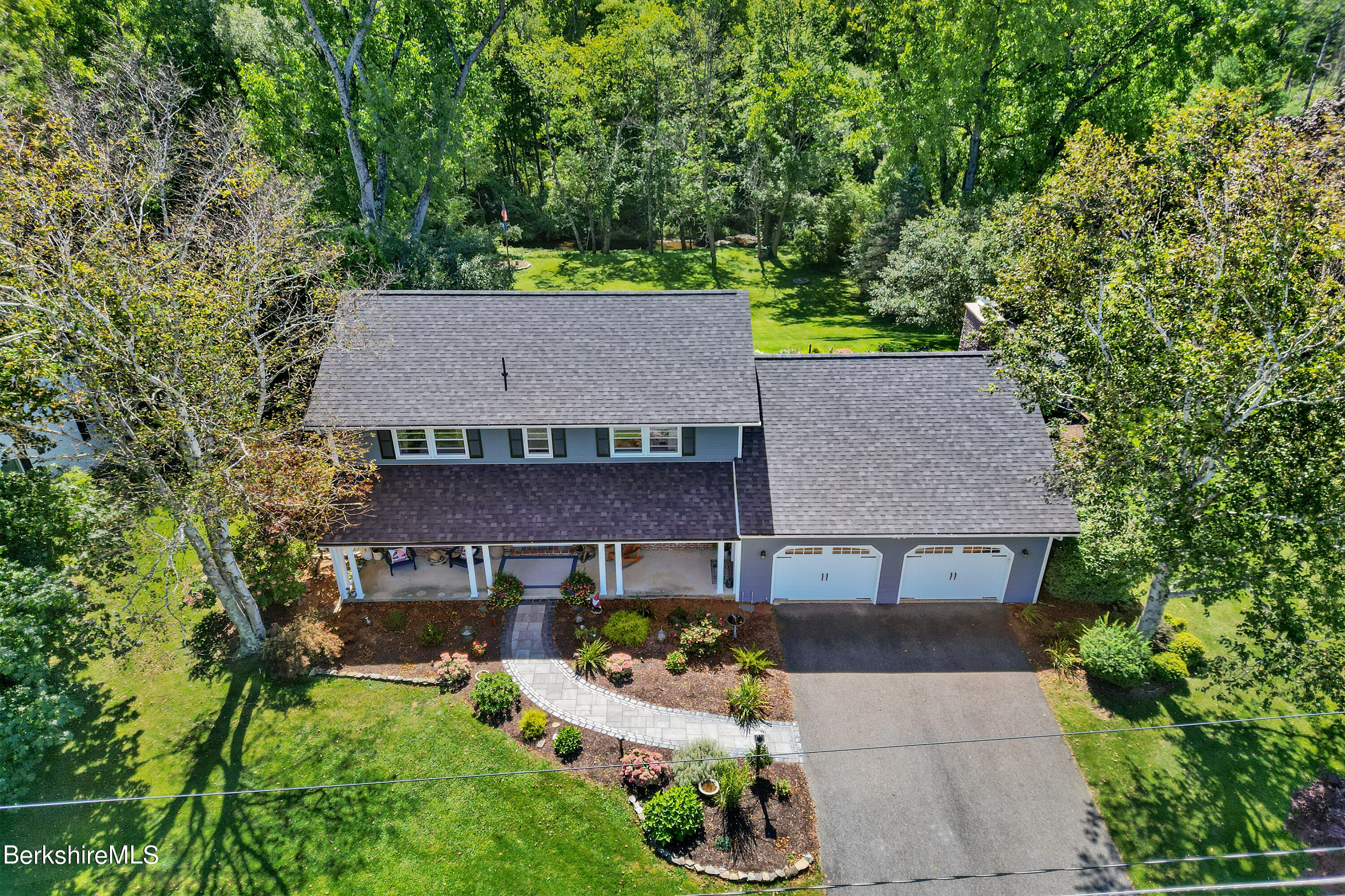 84 Brookside Drive Pittsfield, MA 01201 - Photo 50 of 54 an aerial view of a house with yard and trees in the background