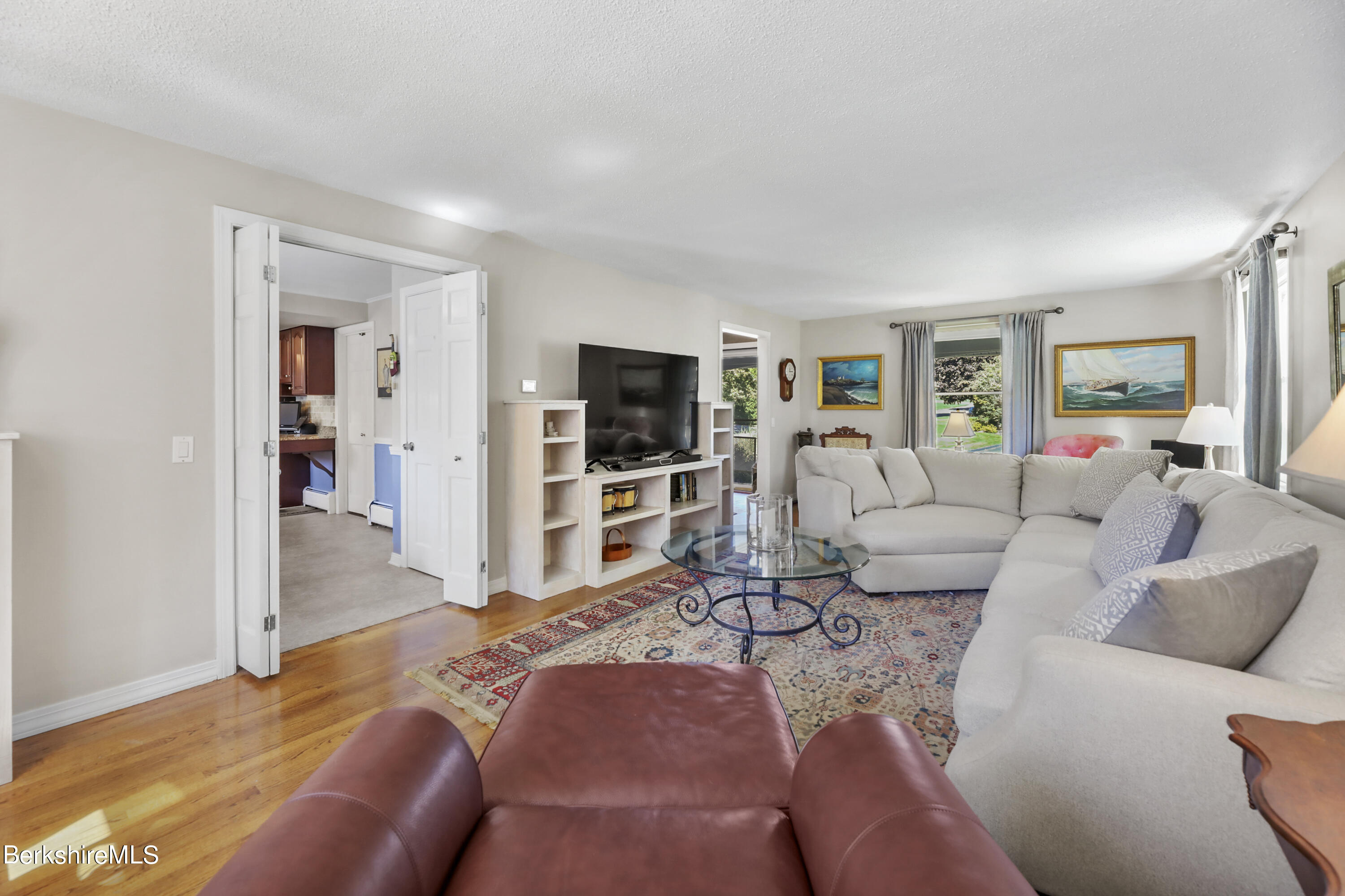 84 Brookside Drive Pittsfield, MA 01201 - Photo 6 of 54 a living room with furniture and a flat screen tv