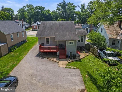 an aerial view of a house with swimming pool