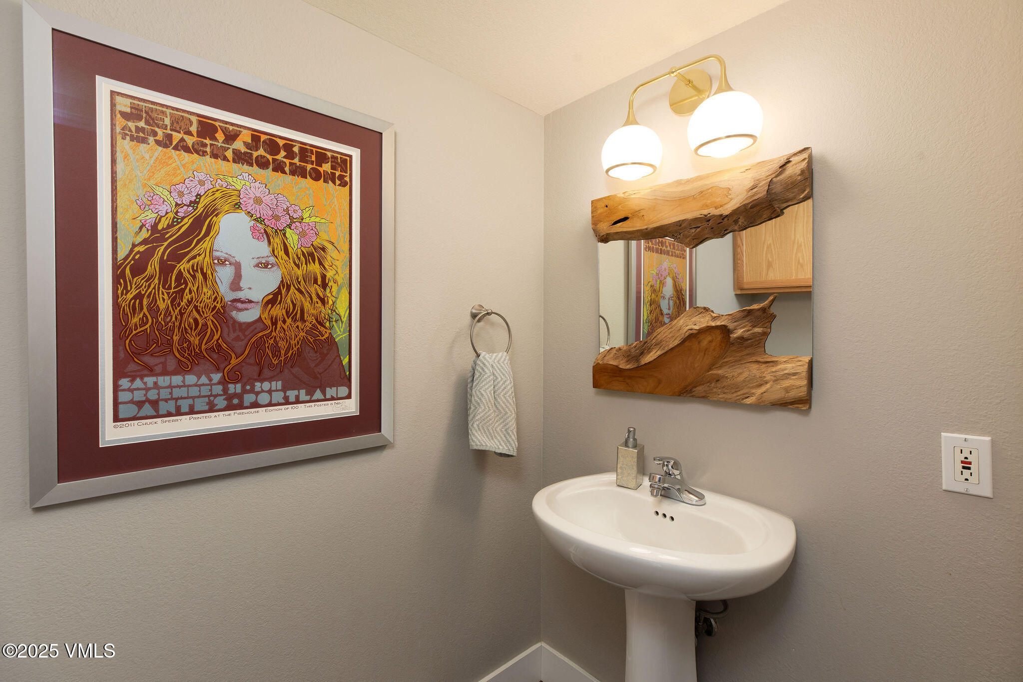 216 Main Street, Unit R311 Edwards, CO 81632 - Photo 9 of 9 a bathroom with a sink and a mirror