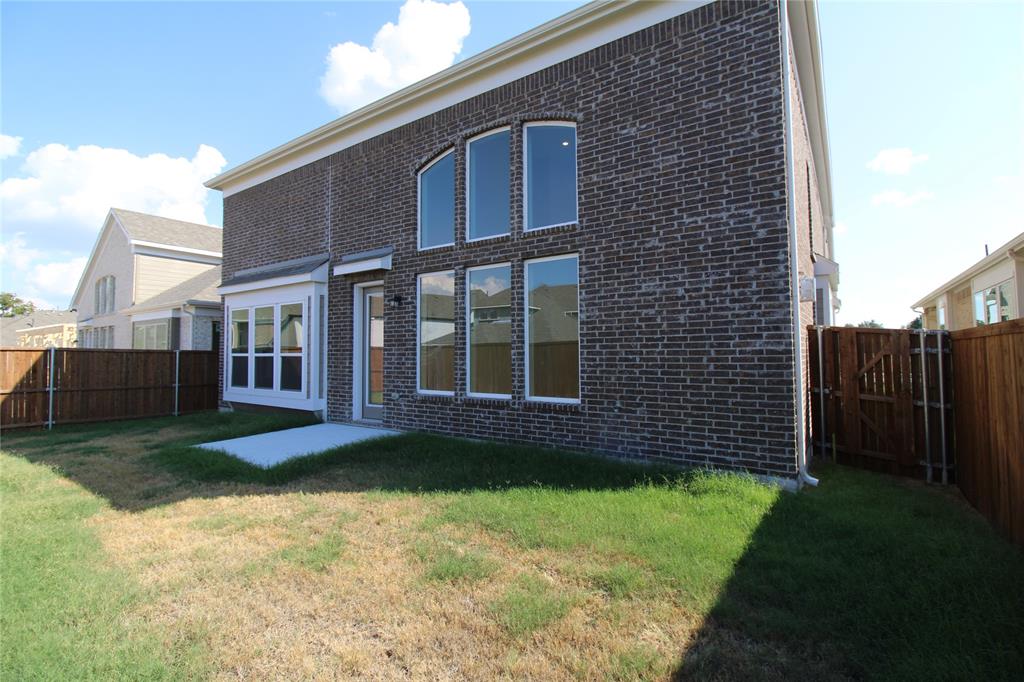 8407 Cornerstone Drive Rowlett, TX 75088 - Photo 2 of 25 Brick exterior featuring multiple arched and rectangular windows