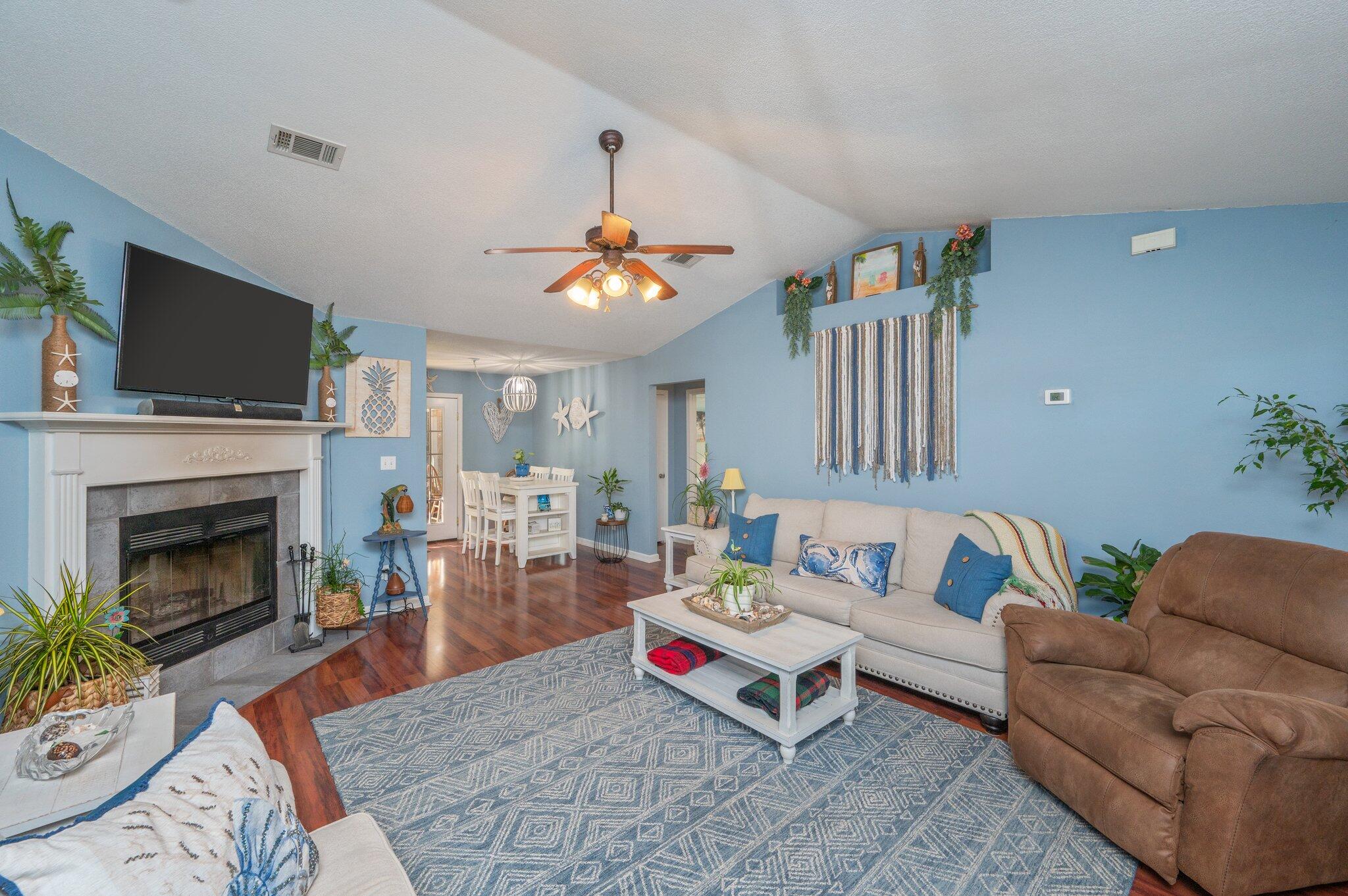 8933 Highway 90 Milton, FL 32583 - Photo 12 of 31 a living room with furniture and a fireplace