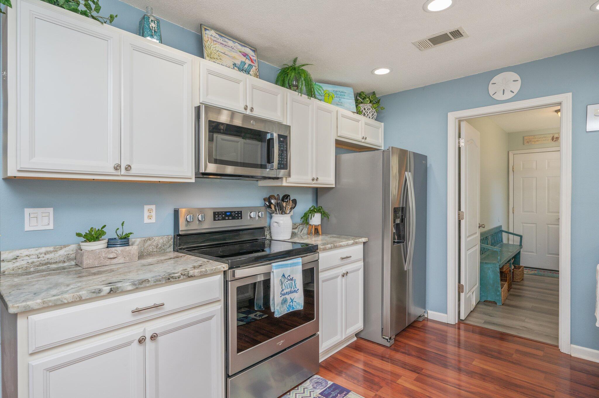 8933 Highway 90 Milton, FL 32583 - Photo 15 of 31 a kitchen with stainless steel appliances granite countertop a refrigerator stove and sink