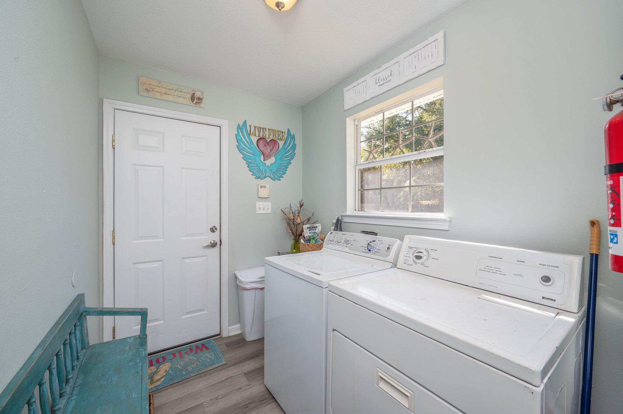8933 Highway 90 Milton, FL 32583 - Photo 16 of 31 a utility room with dryer and washer