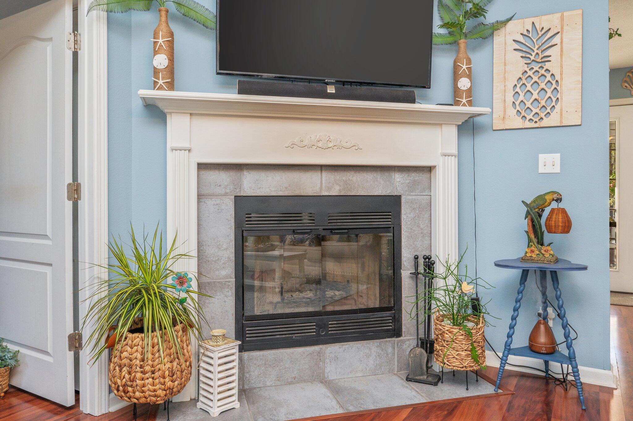 8933 Highway 90 Milton, FL 32583 - Photo 23 of 31 a living room with furniture and a fireplace