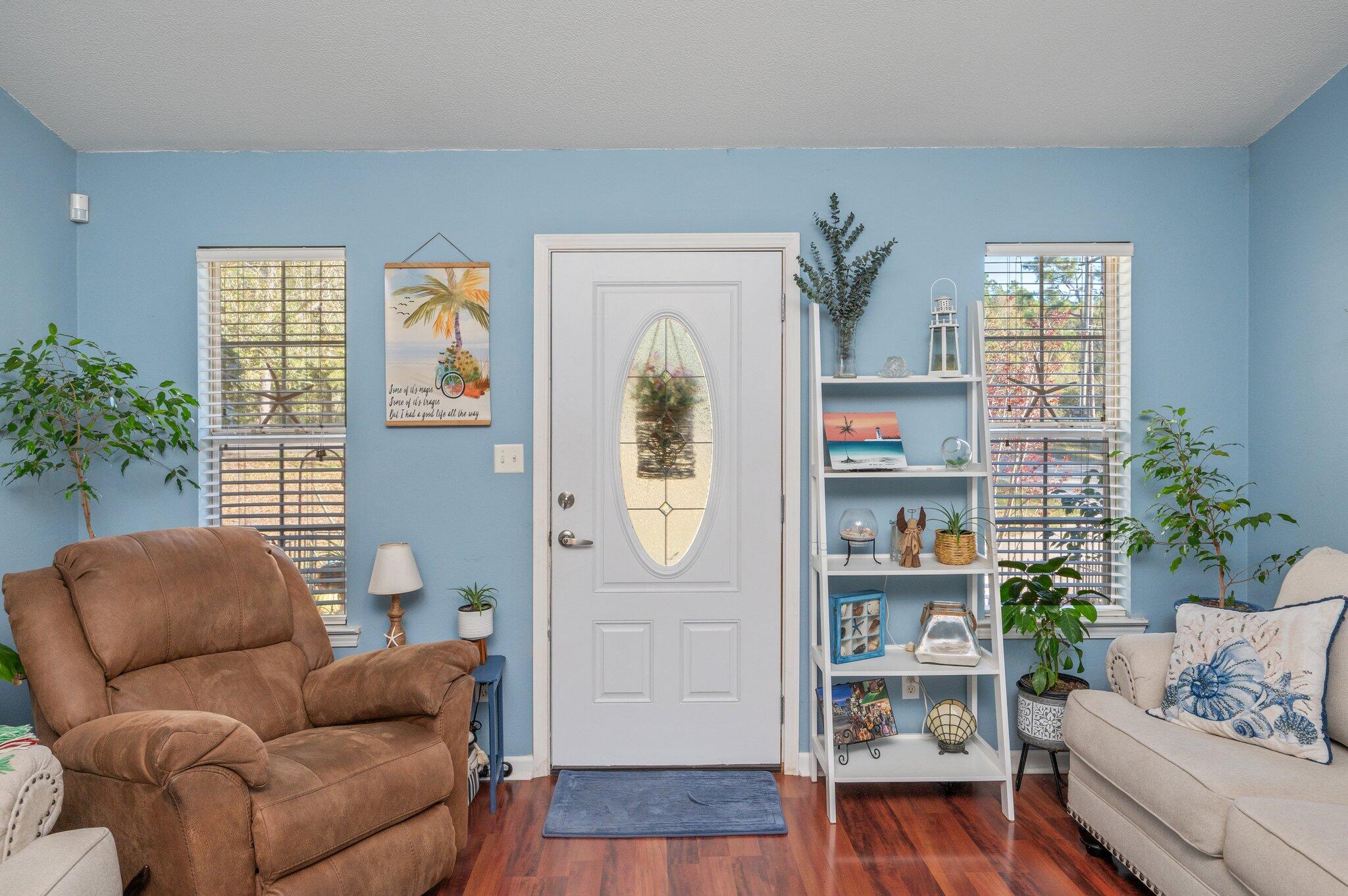 8933 Highway 90 Milton, FL 32583 - Photo 24 of 31 a living room with furniture and a window