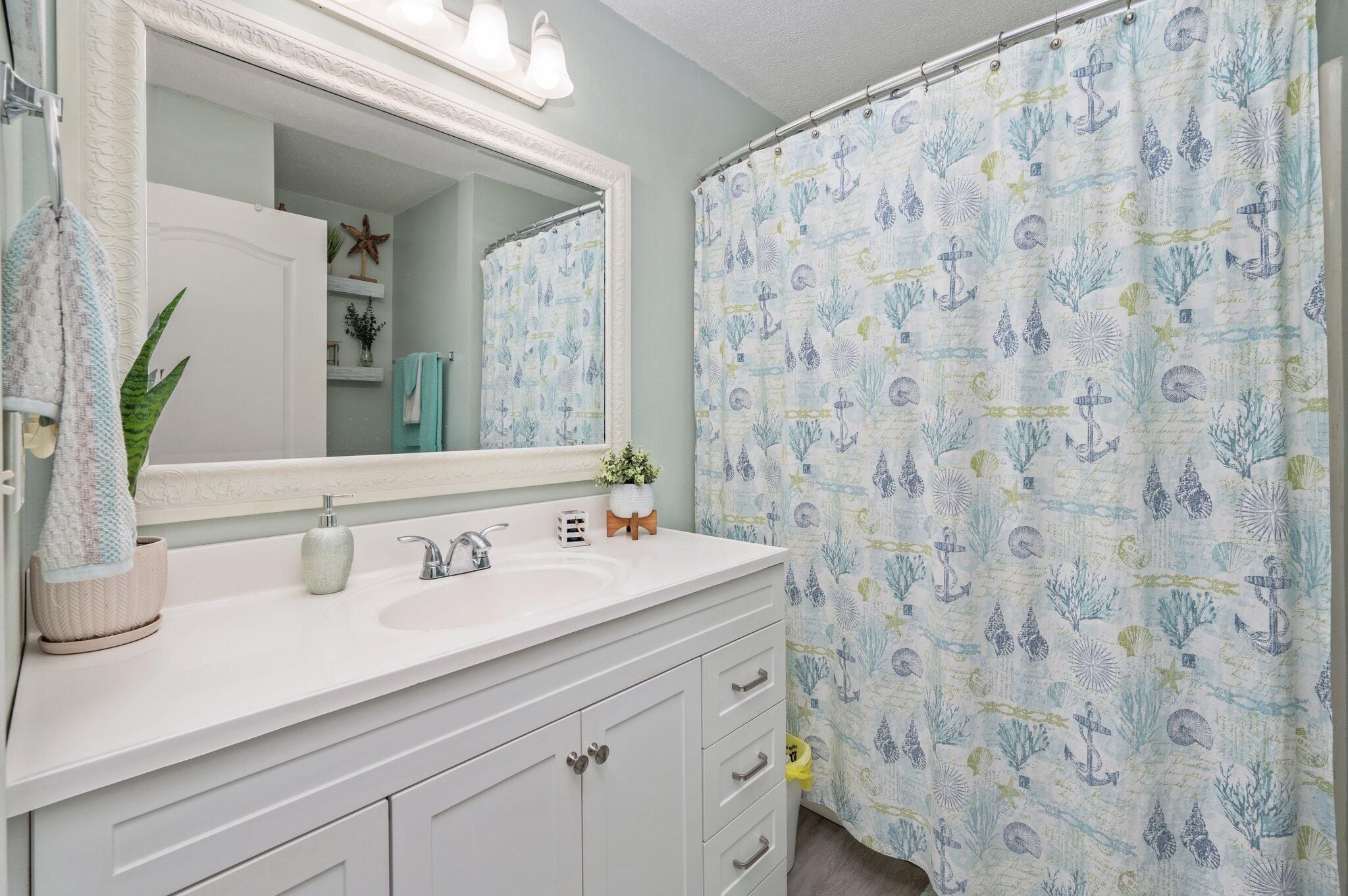 8933 Highway 90 Milton, FL 32583 - Photo 27 of 31 a bathroom with a sink and a mirror