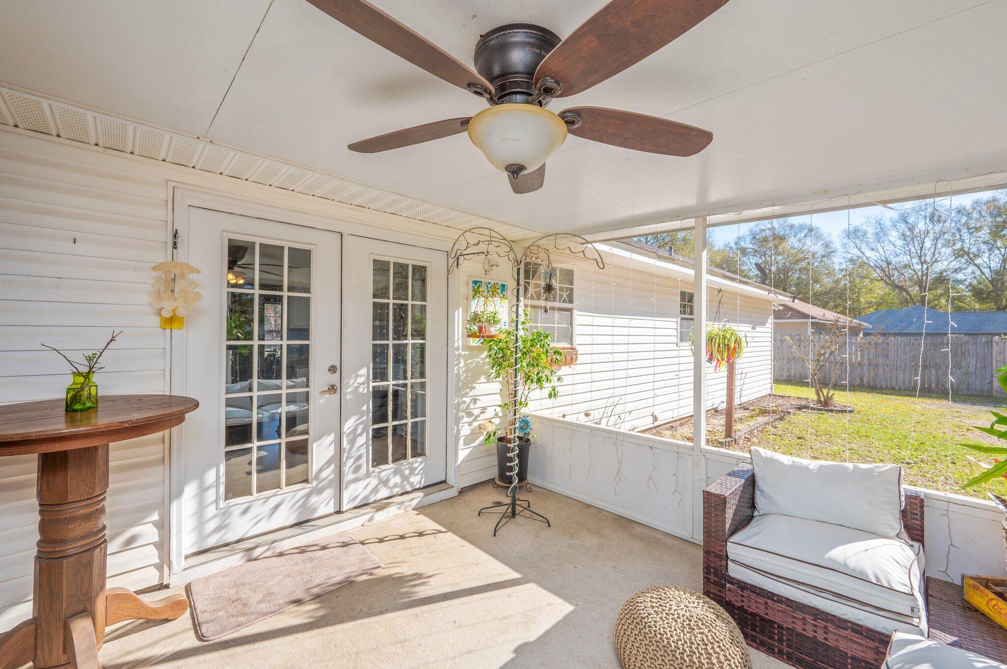 8933 Highway 90 Milton, FL 32583 - Photo 28 of 31 a living room with furniture and a window