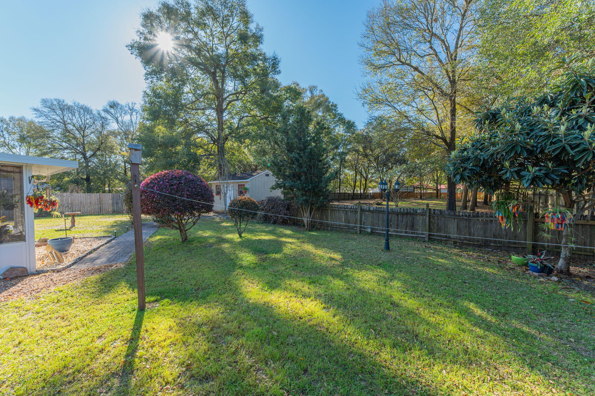 8933 Highway 90 Milton, FL 32583 - Photo 30 of 31 a view of swimming pool with a bench and trees