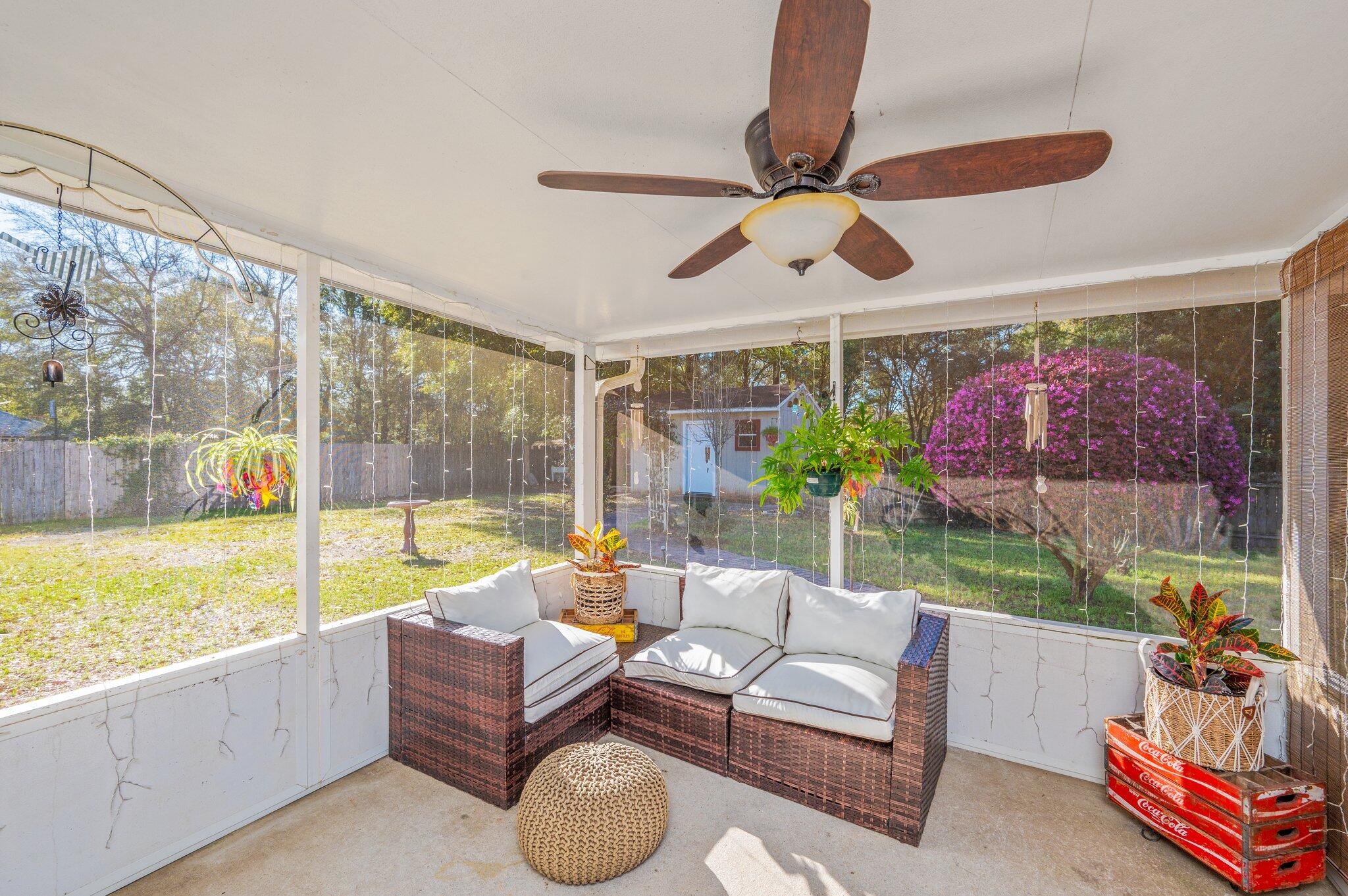 8933 Highway 90 Milton, FL 32583 - Photo 3 of 31 a living room with furniture and a large window