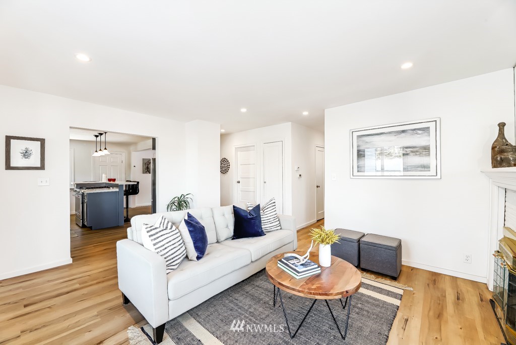 2117 Southwest Trenton Street Seattle, WA 98106 - Photo 2 of 18 a living room with furniture and wooden floor