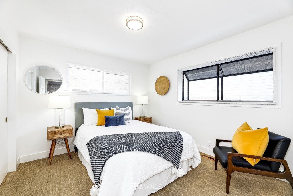 2117 Southwest Trenton Street Seattle, WA 98106 - Photo 11 of 18 a bedroom with a bed and window