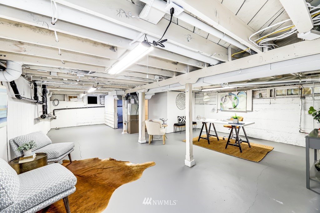 2117 Southwest Trenton Street Seattle, WA 98106 - Photo 14 of 18 a living room with furniture and a chandelier