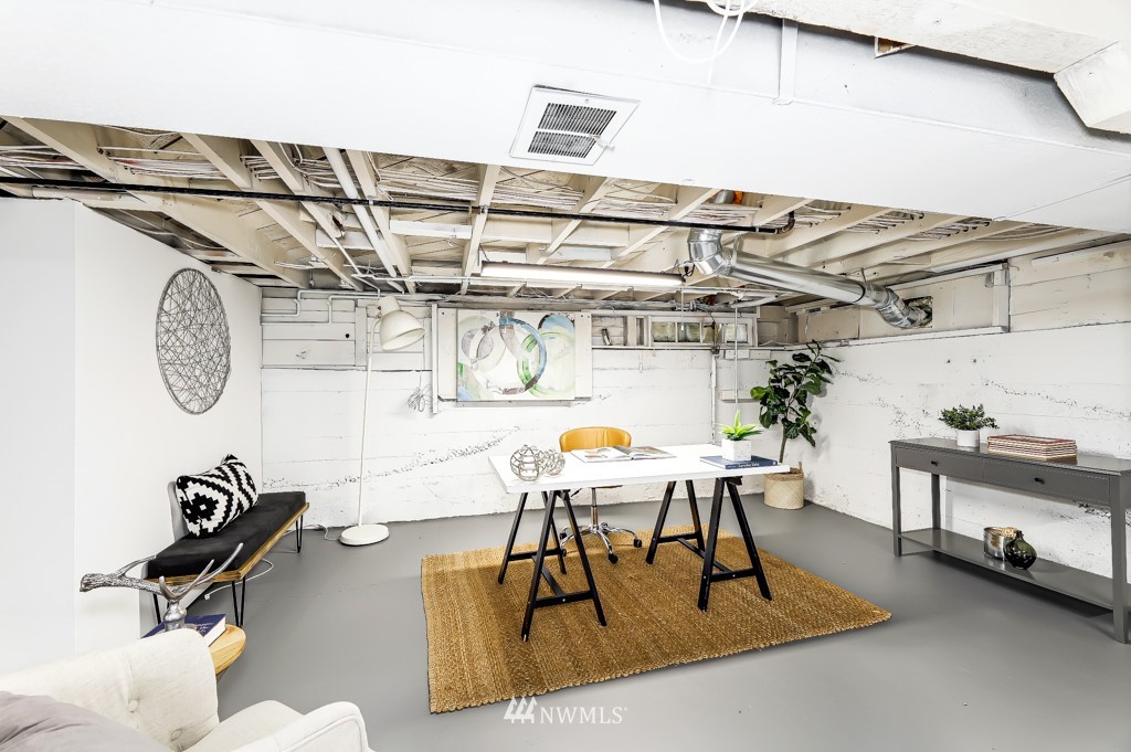 2117 Southwest Trenton Street Seattle, WA 98106 - Photo 16 of 18 a dining room with a table and chairs