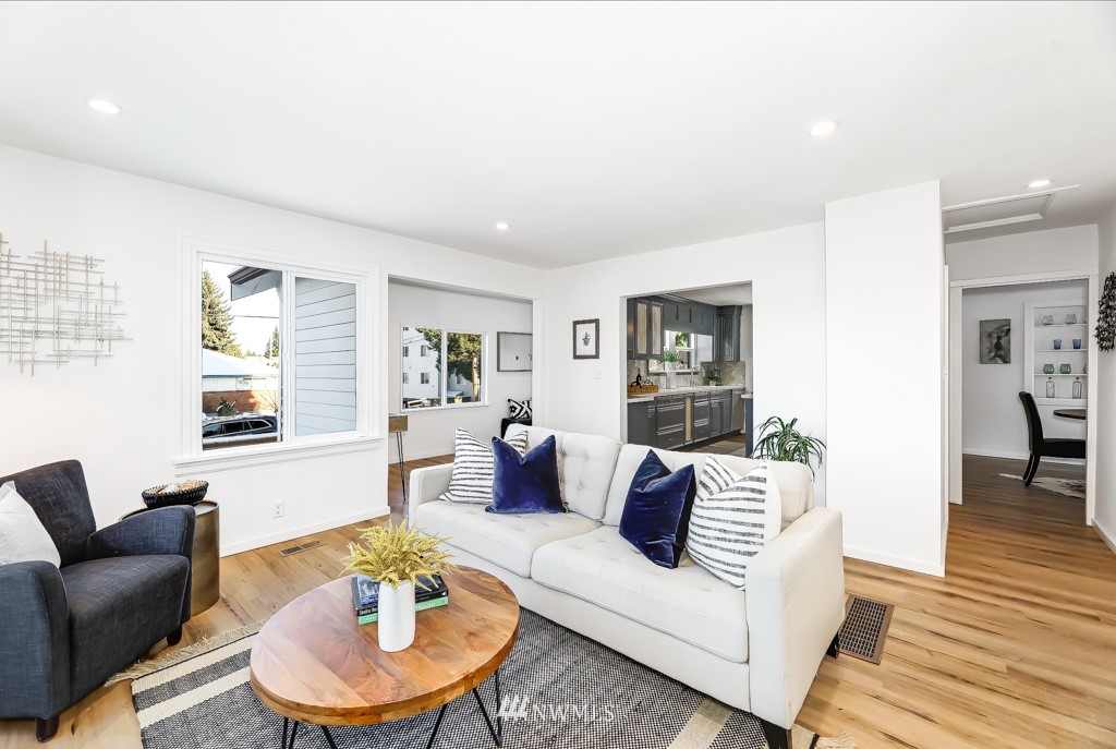 2117 Southwest Trenton Street Seattle, WA 98106 - Photo 3 of 18 a living room with furniture and a wooden floor
