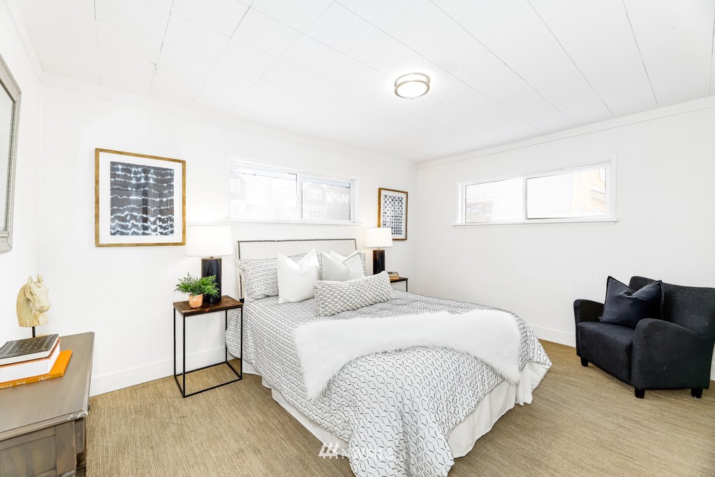 2117 Southwest Trenton Street Seattle, WA 98106 - Photo 10 of 18 a bedroom with a bed and a couch