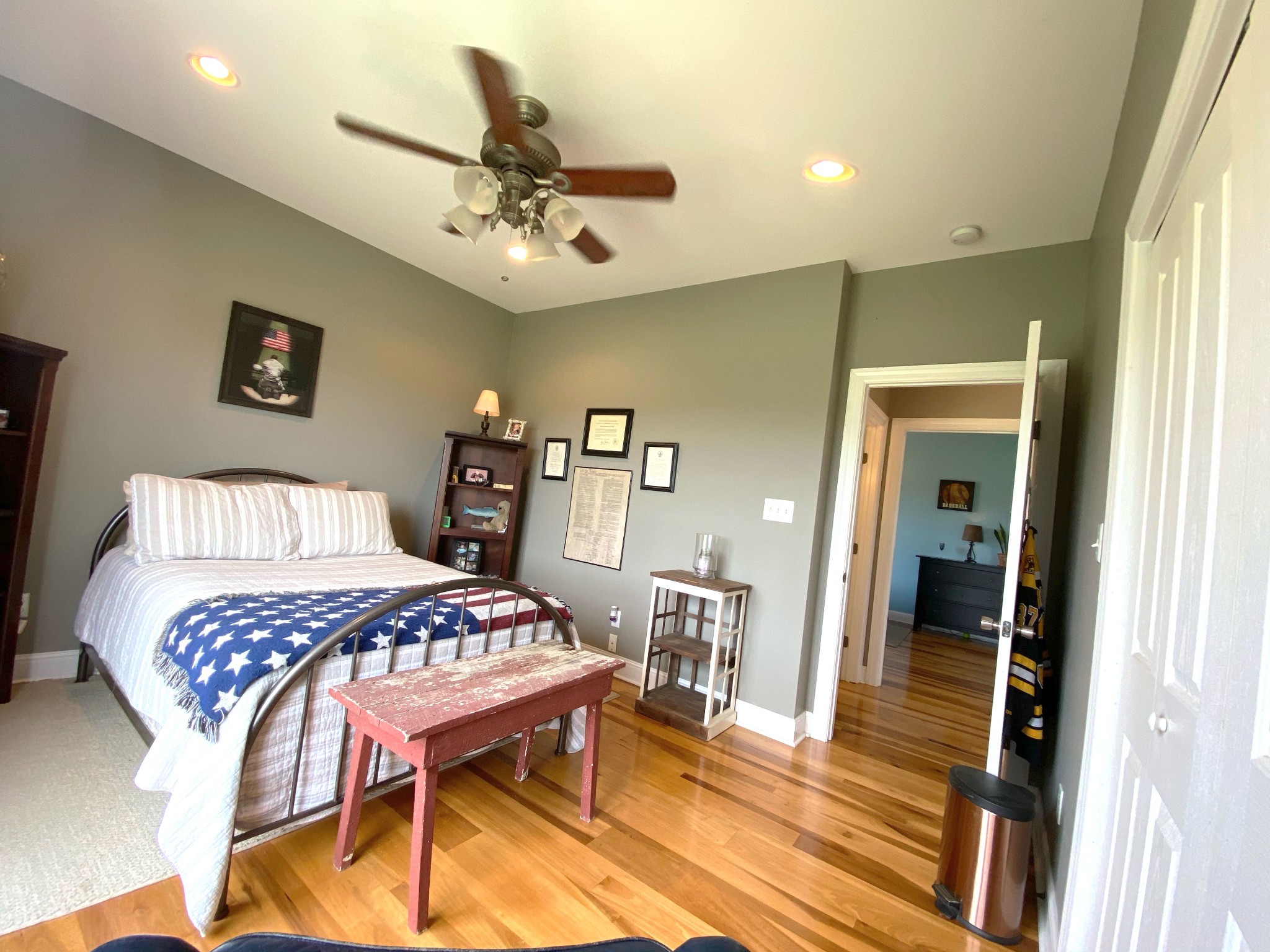 585 Blooming Grove Road Pulaski, TN 38478 - Photo 13 of 41 a bedroom with a bed and a chandelier