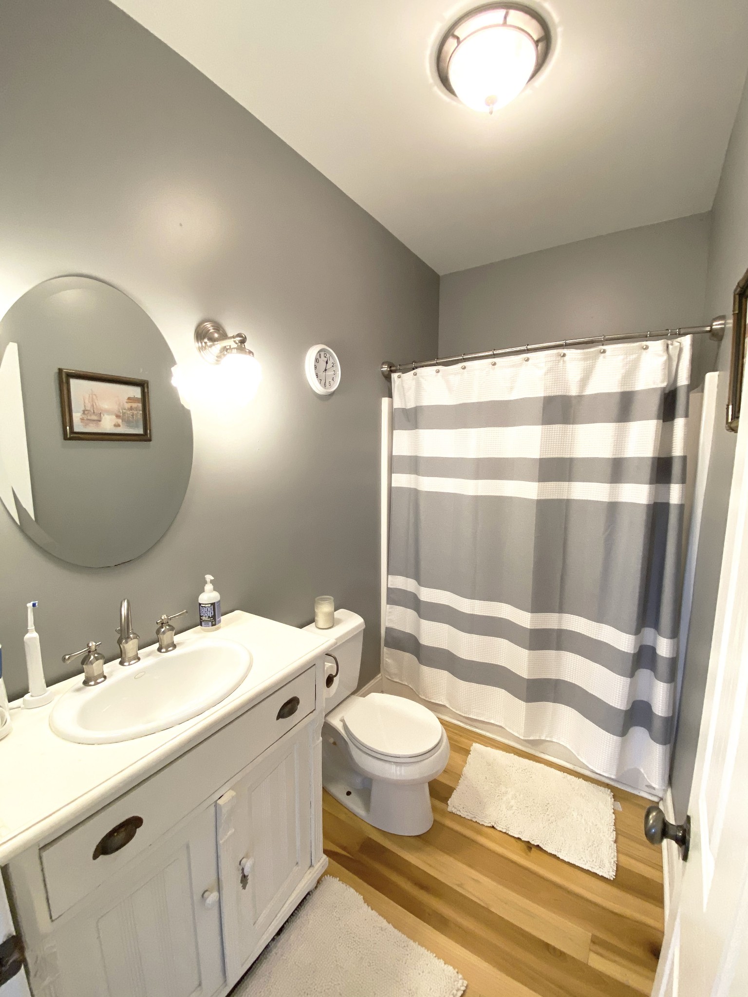 585 Blooming Grove Road Pulaski, TN 38478 - Photo 14 of 41 a bathroom with a sink a toilet and a mirror