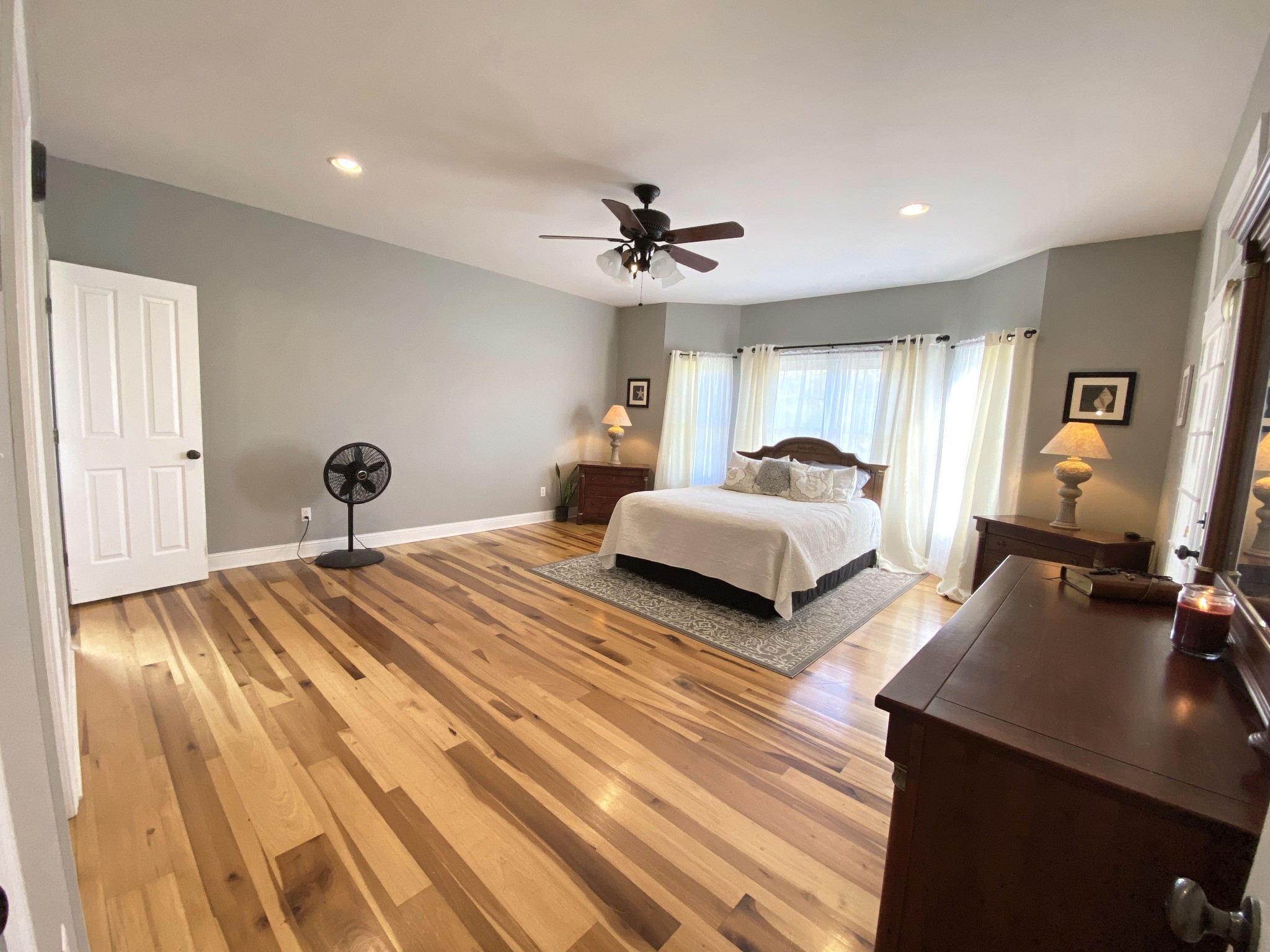 585 Blooming Grove Road Pulaski, TN 38478 - Photo 8 of 41 a bedroom with bed and a chandelier